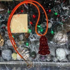 Red Buddha Pendant on Orange Cord Necklace